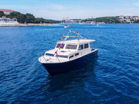 A beautiful boat cruising through clear blue waters, showcasing its sleek design and vibrant decorations, perfect for a day on the water.