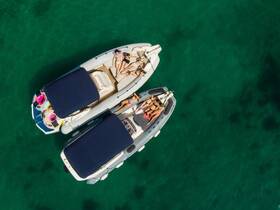 Aerial view of a group enjoying a sunny day on two boats, relaxing and sunbathing in crystal-clear waters — the perfect summer getaway.