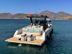 Guests enjoy a relaxing day on a stylish boat, surrounded by stunning coastal views — perfect for a day of leisure on the water.