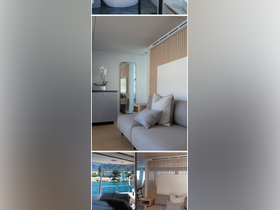 A stylish interior view of a boat's lounge area featuring modern seating and elegant decor, perfect for relaxing while enjoying the scenic views outside.