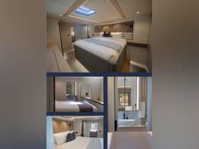 A beautifully designed boat interior featuring a spacious cabin with a comfortable bed and modern amenities, perfect for relaxing during your nautical adventures.