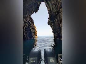A stunning view from inside a cave looking out to the ocean, showcasing the natural beauty of coastal landscapes — perfect for adventure seekers exploring hidden gems by boat.