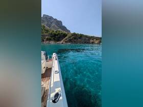 A stunning view of a boat gliding through crystal-clear waters, with a picturesque rocky coastline in the background — perfect for exploring hidden coves and enjoying the beauty of nature.