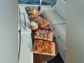 An inviting spread of gourmet snacks and charcuterie displayed on a boat, perfect for enjoying while cruising on the water.