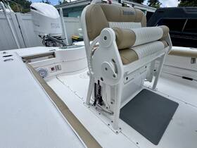 A close-up view of the helm seating area on an Everglades boat, showcasing the comfortable design and layout ideal for fishing or cruising.
