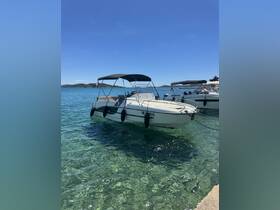 A sleek speedboat docked in crystal-clear waters, perfect for a day of adventure on the sea.