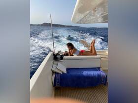 A woman relaxes on the deck of a yacht, enjoying the ocean breeze while sunbathing — a perfect moment of leisure on the water.