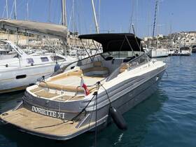 A sleek yacht named Doriette XI docked in a marina, showcasing its elegant design and spacious deck — perfect for luxury outings on the water.