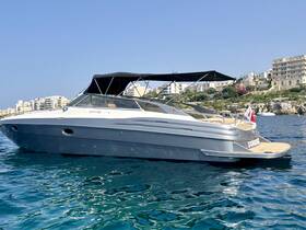 A sleek yacht anchored in clear waters, showcasing its elegant design against a picturesque coastal backdrop — perfect for luxury outings and day trips.