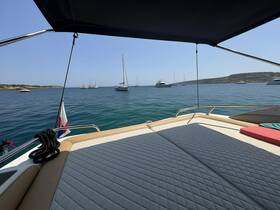 A serene view from the deck of a yacht, showcasing the calm waters and other vessels in the distance — perfect for a relaxing day on the water.