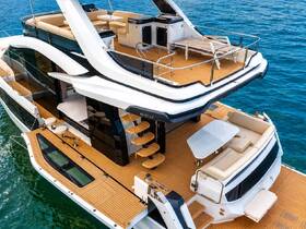 An elegant interior view of a luxurious yacht showcasing spacious seating and lounge areas, perfect for relaxing on the water.