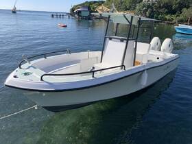 A sleek center console boat docked in calm waters, showcasing its modern design and inviting atmosphere for a day on the water.
