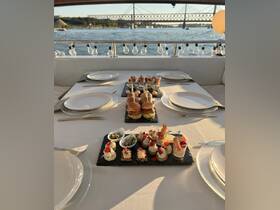 An elegant spread of gourmet appetizers and drinks set on a boat table, perfect for a luxurious dining experience on the water.