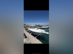 A sleek yacht docked at the marina, showcasing its elegant design against a clear blue sky — perfect for luxury outings and charters.