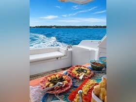A beautifully arranged charcuterie platter featuring meats, cheeses, and fresh vegetables, perfect for enjoying on a boat while cruising through scenic waters.