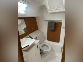Interior view of a boat bathroom featuring a modern sink and toilet, showcasing the clean and functional design typical of marine cabins.