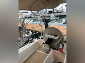 A detailed view of the helm area inside a boat, showcasing the steering console and seating, perfect for navigating the waters.