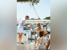 A group of friends boards a boat under the sun, capturing the excitement of a day on the water — perfect for summer adventures and social gatherings.