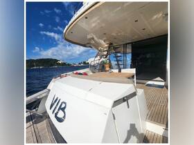 A stylish interior view of a yacht showcasing the seating area and helm, perfect for relaxing and enjoying the scenic waterfront.