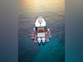 A lively group enjoys a fun day on a pontoon boat, with some relaxing in the water and others on deck, creating the perfect atmosphere for summer adventures.
