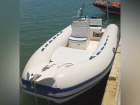 A sleek speedboat docked at the marina, showcasing its clean lines and spacious seating, perfect for a day on the water.