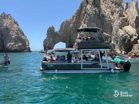 A lively group enjoys a day on the water near the iconic rock formations of Cabo San Lucas, showcasing the perfect blend of adventure and scenic beauty.