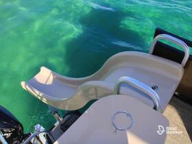 A close-up view of a water slide attached to a boat, perfect for fun and excitement on the water. Ideal for family outings or party boat experiences.