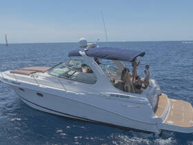 A lively group enjoys a day on the water aboard a boat in Cabo San Lucas, perfect for celebrations and fun in the sun.