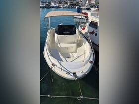 A well-maintained speedboat docked at the marina, showcasing its sleek design and rental availability — perfect for a day on the water.