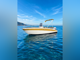 A stunning speedboat glides through crystal-clear waters, showcasing its sleek design against a picturesque coastal backdrop.