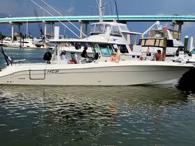 A group of friends enjoys a day on the water aboard a fishing boat at the marina, showcasing the perfect blend of relaxation and adventure.