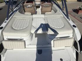 Interior view of a boat's seating area, showcasing comfortable cushions and a well-designed cabin space, perfect for relaxing on the water.