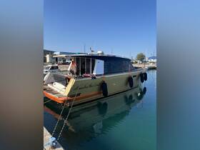 A beautifully docked yacht named 'Alexandra the Great' reflects in the calm waters, showcasing its elegant design and perfect for luxury charters.