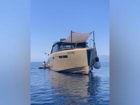 A person enjoys a relaxing fishing experience beside a stylish boat on calm waters, perfect for a day of leisure and adventure.