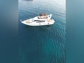 A stunning aerial view of a luxurious yacht cruising through clear blue waters, perfect for upscale charters and leisure outings.