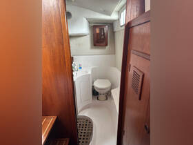 Interior view of a boat's bathroom, showcasing the clean and functional design, ideal for comfort during voyages.