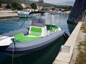 A sleek speedboat docked at the marina, showcasing its modern design and vibrant green seating, perfect for a day on the water.