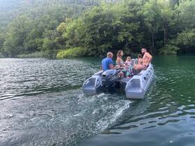 A joyful family enjoys a boating adventure on a serene lake, creating lasting memories together amidst lush greenery.