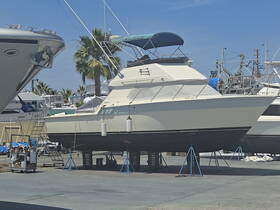 A sleek yacht docked in a marina, showcasing its elegant design and structure, perfect for luxury outings on the water.