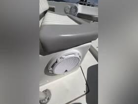 Close-up view of a boat's seating area featuring integrated speakers, perfect for enjoying music while on the water.