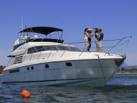 A group of friends enjoys a lively moment on the deck of a yacht, perfect for celebrations and memorable outings on the water.