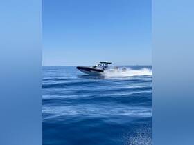 A speedboat glides across the shimmering blue waters, showcasing an exciting day on the sea with friends or family.