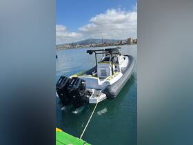 A sleek speedboat docked in calm waters, showcasing its modern design and powerful twin engines, perfect for thrilling adventures on the water.