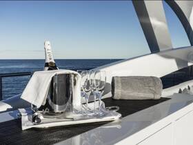 An elegant setup featuring a bottle of Moët champagne and glasses on a yacht, perfect for celebrating special moments while enjoying the ocean view.
