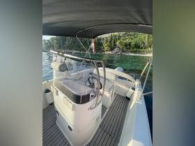 Interior view of a boat's helm and console area, showcasing a sleek design and comfortable layout, perfect for navigating serene waters.