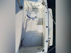 An overhead view of a boat's interior featuring a white seating area, ideal for relaxing while on the water.