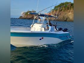 Two anglers prepare for a fishing adventure aboard a boat in the beautiful waters of Panama, showcasing the excitement of ocean fishing.