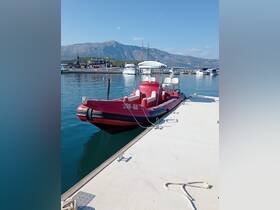 A vibrant red speedboat docked at a marina, surrounded by stunning mountain views — perfect for exploring coastal waters.