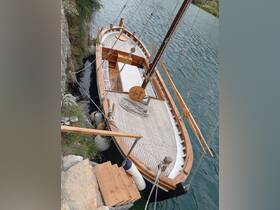 A beautifully crafted wooden boat docked by the shore, showcasing its elegant design and craftsmanship — perfect for scenic tours or private charters.