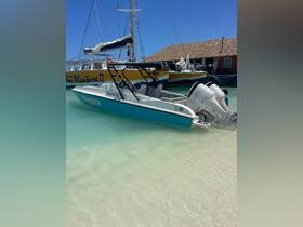 A sleek speedboat docked in shallow waters, showcasing its vibrant design and perfect for thrilling water adventures.